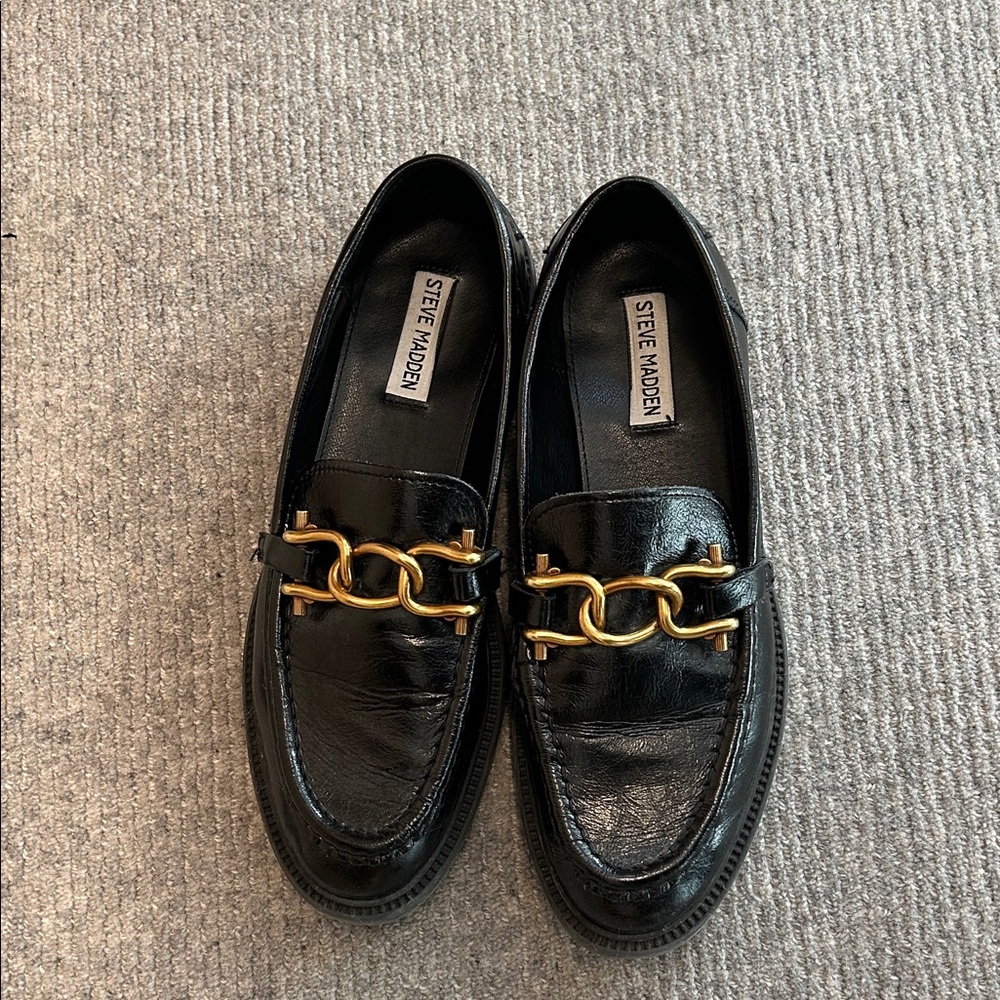 Steve Madden Black Slip-Ons with Gold Chain Detail